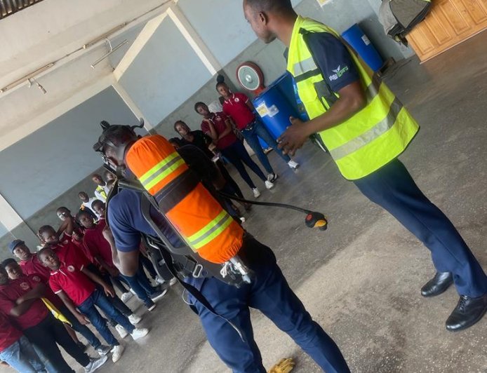 Club members exploring Sunyani Airport terminal, learning about airport facilities and operations.